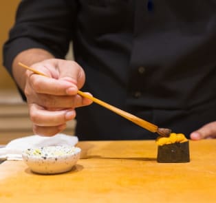 Sushi chef preparing sushi in Tokyo
