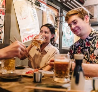 Group having drinks and Japanese food