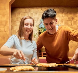 Couple enjoying a cooking class in Kyoto, Japan