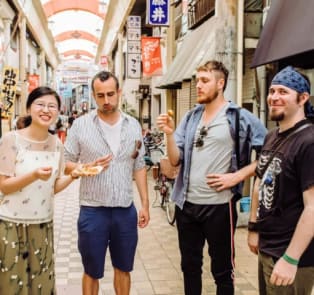Tourists snacking in Asakusa