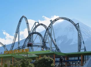 A theme park with Mount Fuji in the back