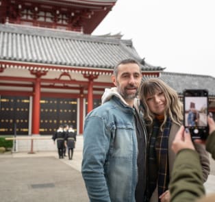 Couple standing in front of the Senso-ji Temple, Japan