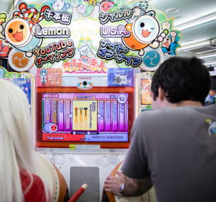 Travelers playing a arcade game