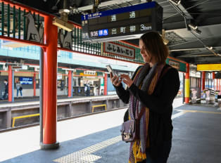 Traveler waiting at a train station in Japan