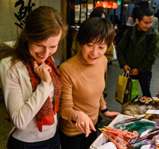 Exploring local specialities on a walking tour in Kyoto