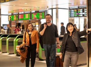 Travelers leaving Kyoto Station with a local host