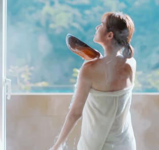 Woman rinsing her body