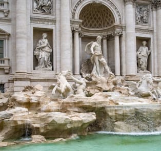 Walk to the Trevi Fountain in the afternoon