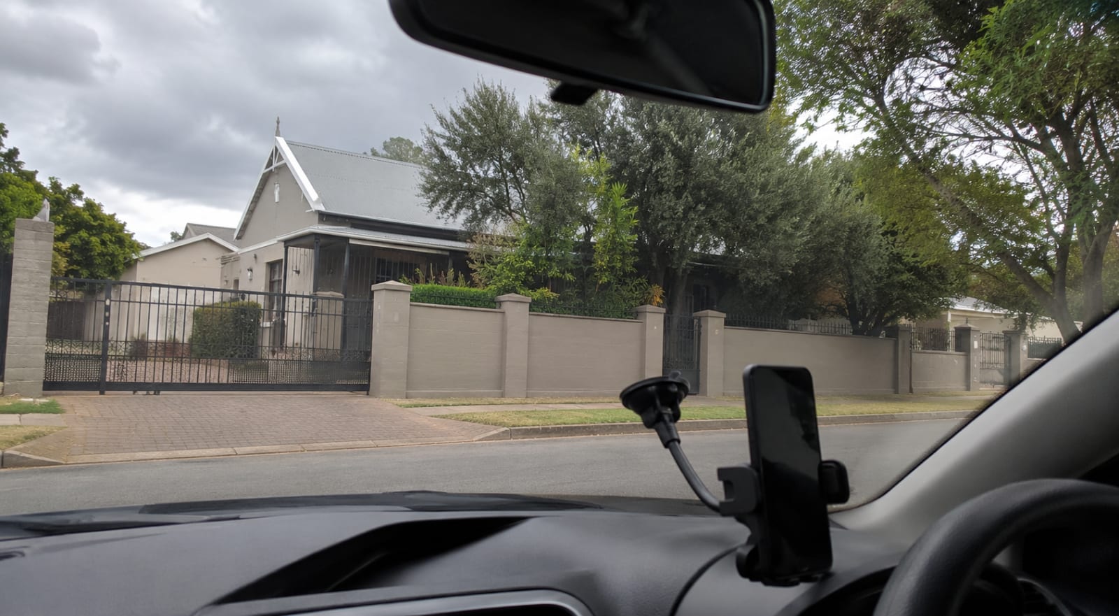The view from a parked car outside a suburban South African property, at the start of an assessment visit.