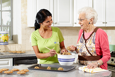 caregiver-baking-with-senior