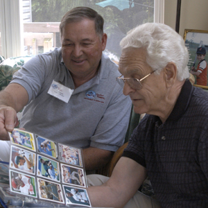 Seniors looking at baseball cards