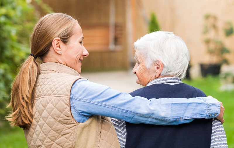 An in home care provider walks with a senior in North Augusta, SC