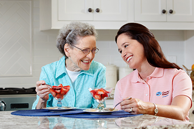 caregiver-eating-sundae-with-senior