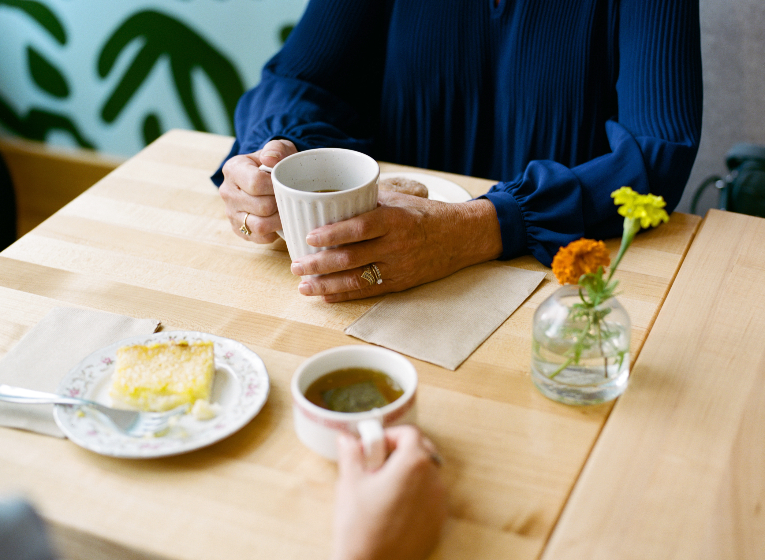 Respite care friends drinking coffee in cafe