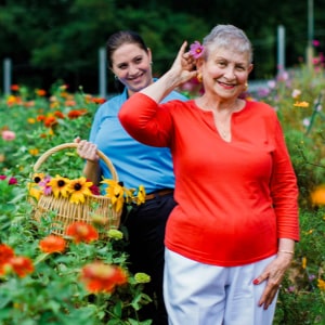 Senior under our personal home care outside with her caregiver in Durango, CO