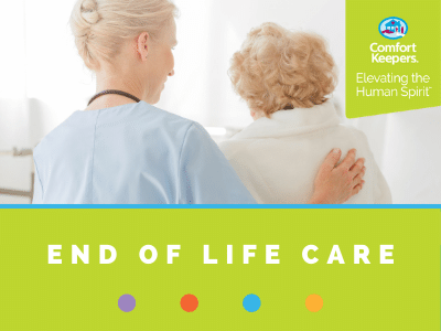 Comfort Keepers Home Care Graphic for End of Life Care - photo of caregiver comforting senior, they are facing away from the camera.