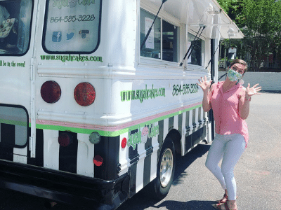 Comfort Keepers team member next to ice cream truck posing for the camera