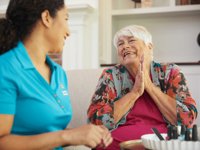 Caregiver and senior have a fun conversation