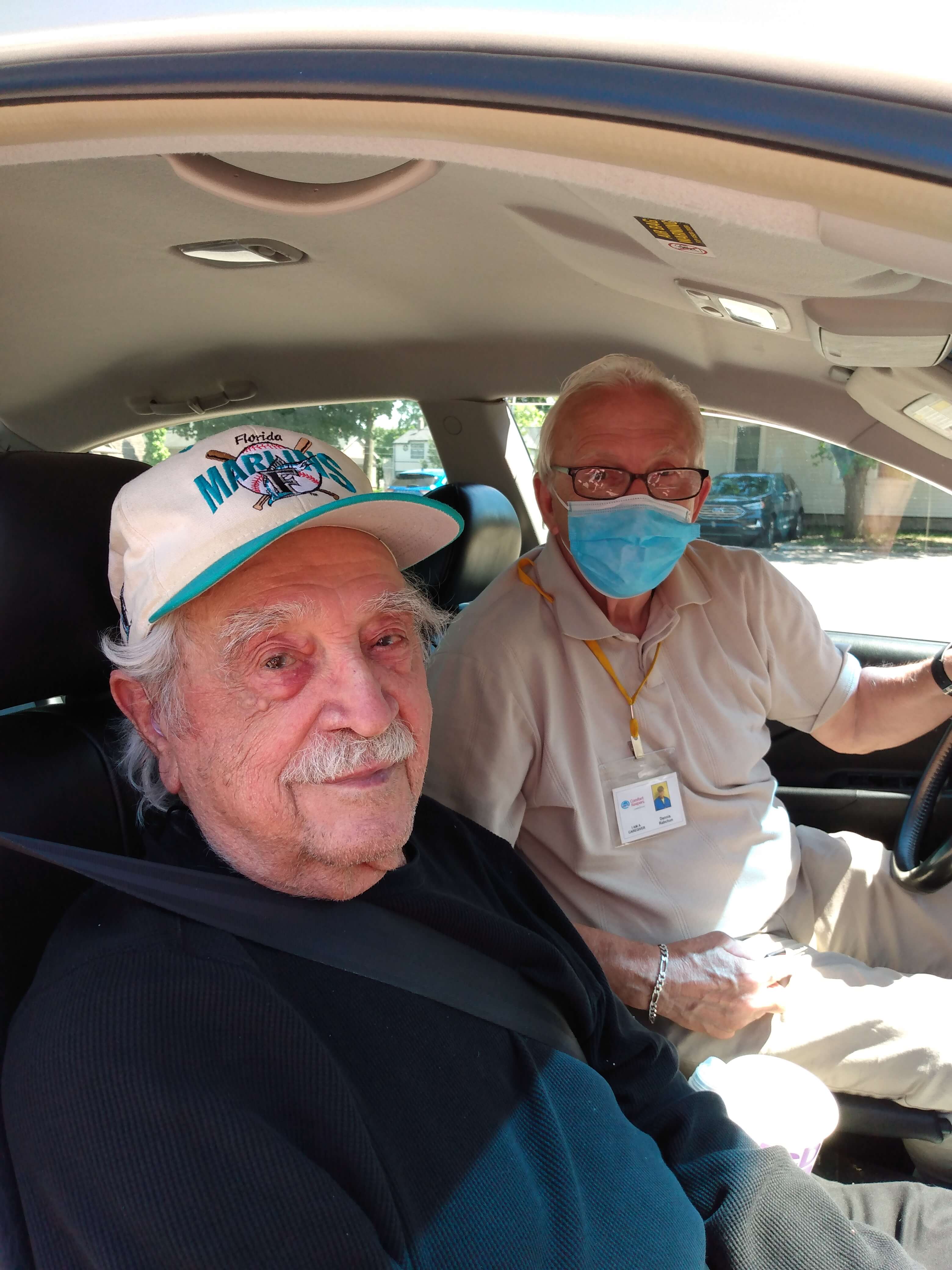 Photo of caregiver and senior client in car