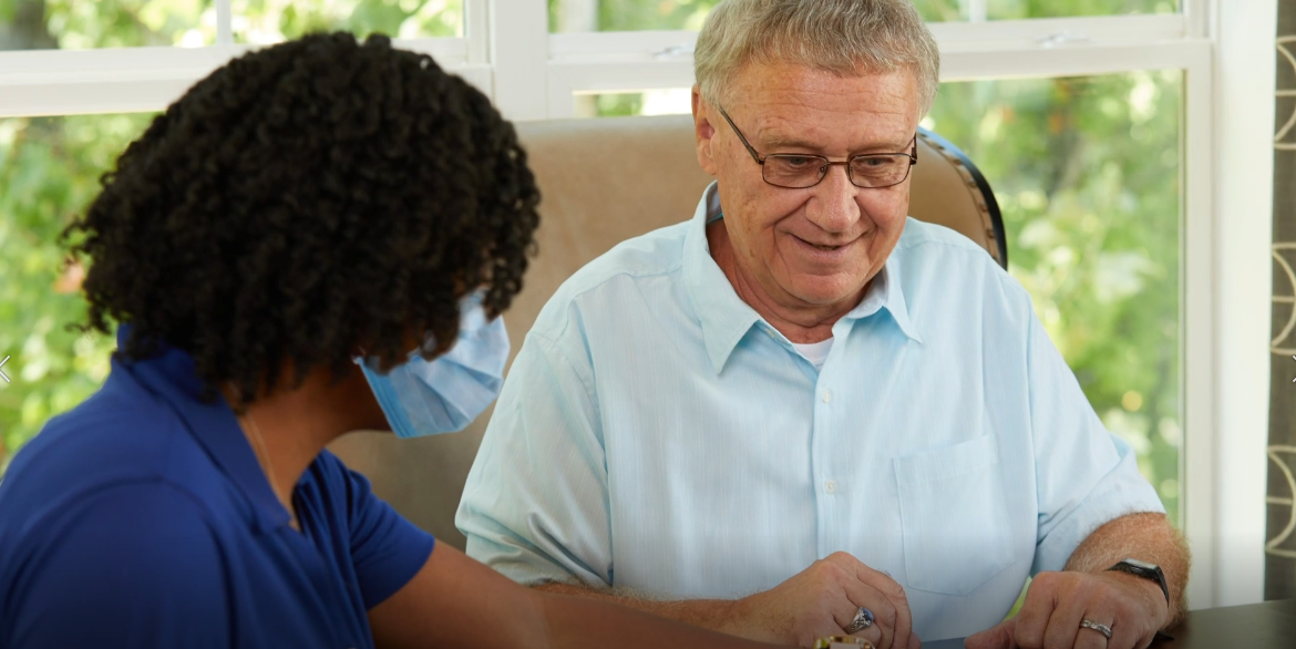 Ladera Ranch Senior and caregiver playing Scrabble inside