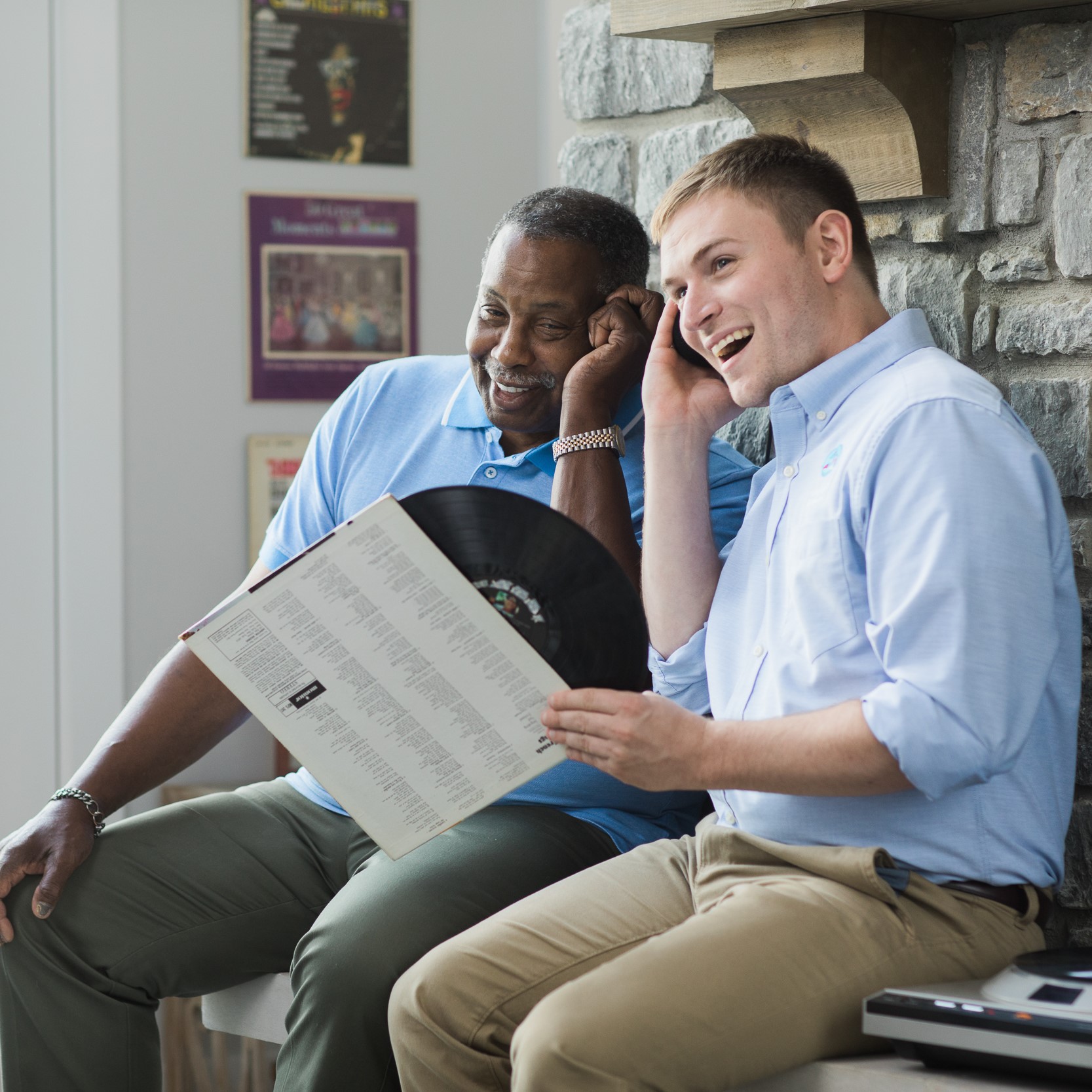 caregiver and senior listening to music