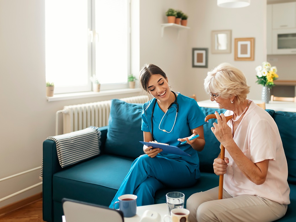 Caregiver going over task list with client