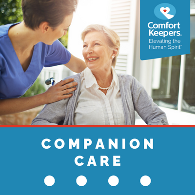 Comfort Keepers Home Care Graphic for Companion Care Services - shows a senior can caregiver playing dominos