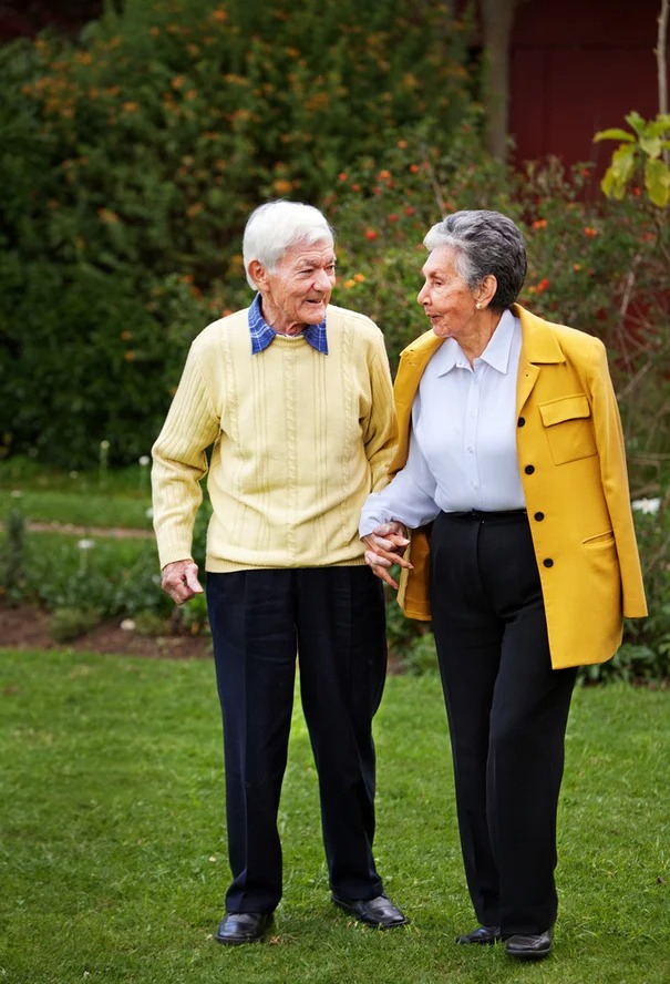 Elder couple walking together at the park