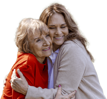 Mother and adult daughter smiling and hugging