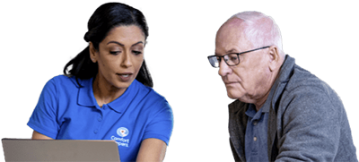Caregiver and client sitting together while on a laptop