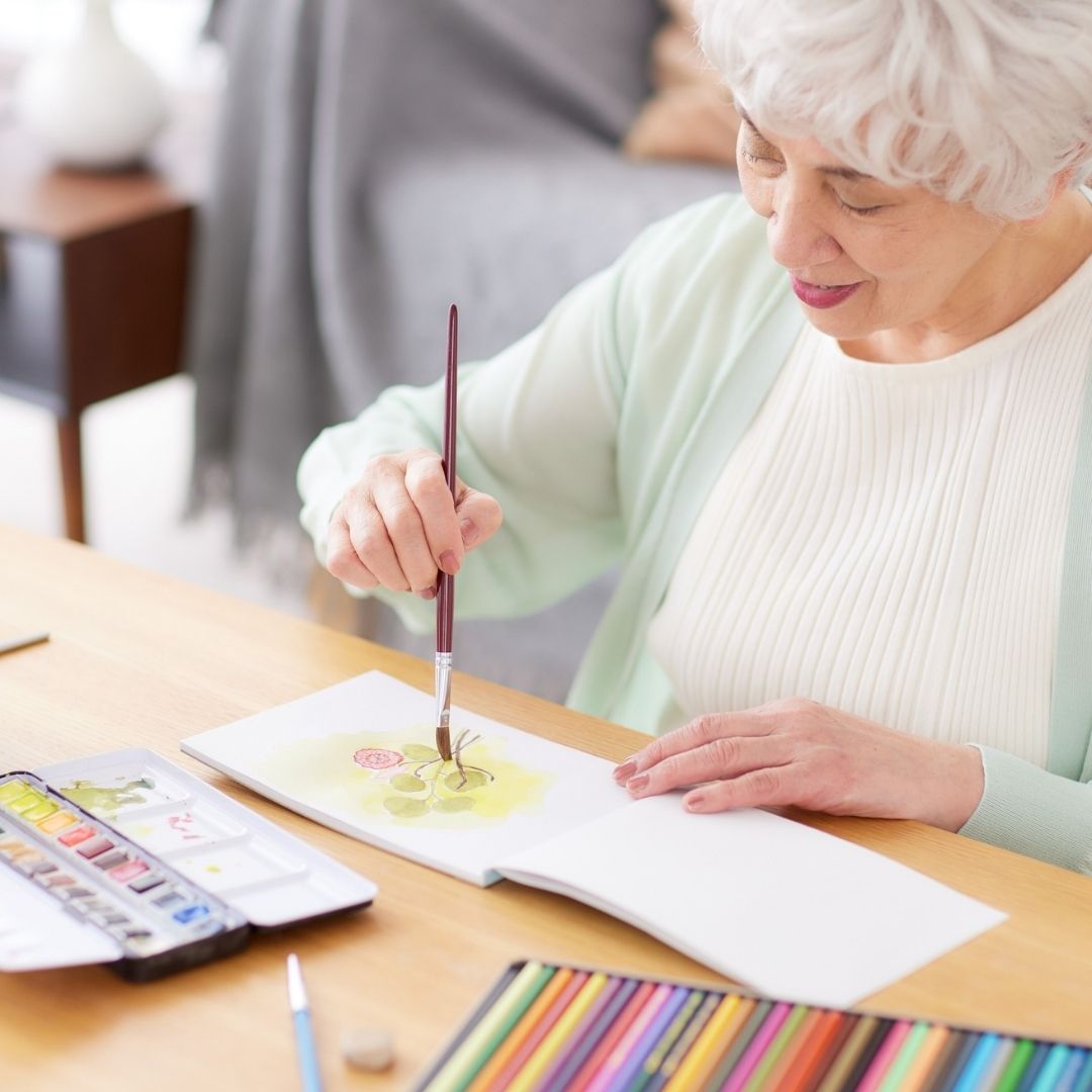 senior painting a picture