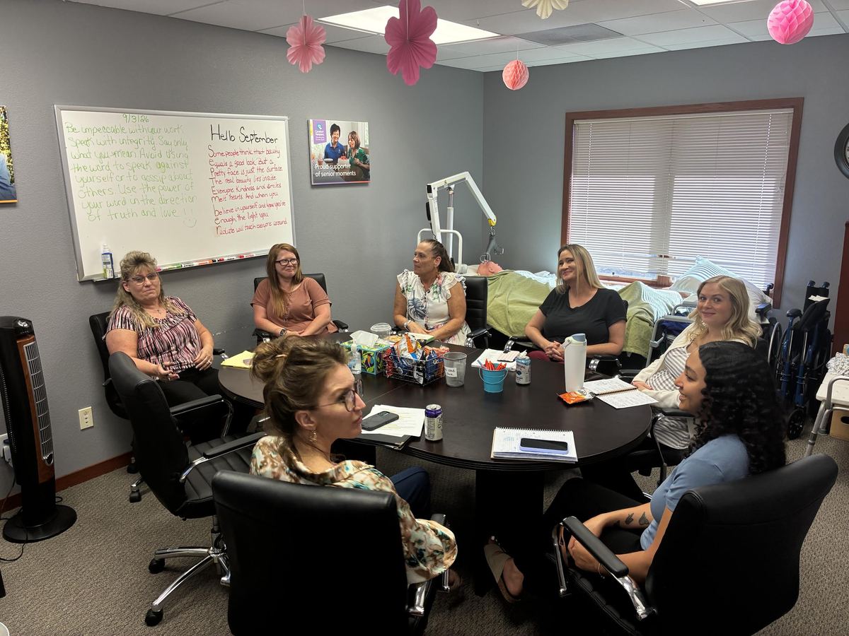 Office team meeting at the Comfort Keepers home care office in South Colorado Springs, CO