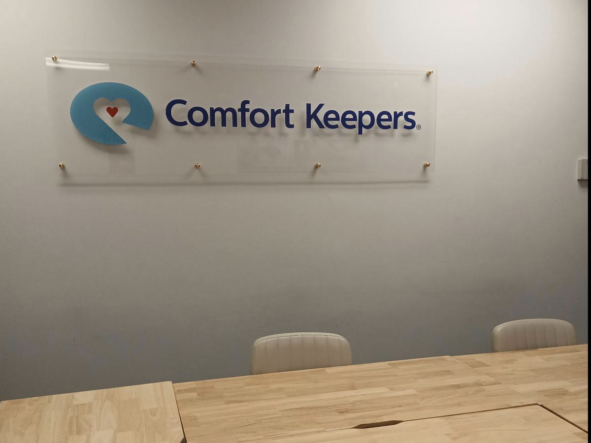 Comfort Keepers sign in the conference room of the Edina, Minnesota home care office