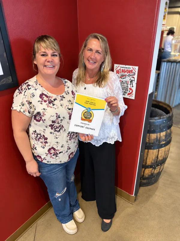 Comfort Keepers team members holding the 2026 Best of Durango and La Plata County Home Health Care Provider award