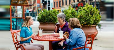 Caregiver having lunch with clients