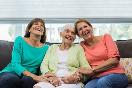Image of a caregiver spending time with senior and adult daughter 