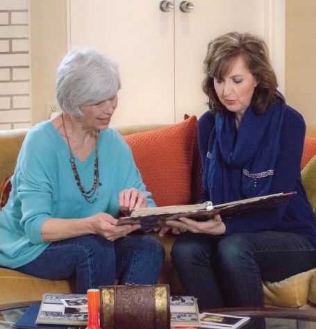 Caregiver looking at an album with client