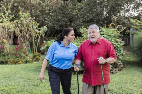 Caregiver walking with client.