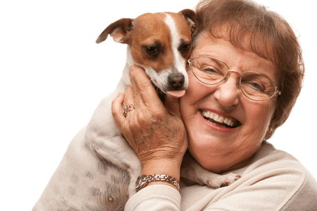 Single senior women smiling with her pet dog