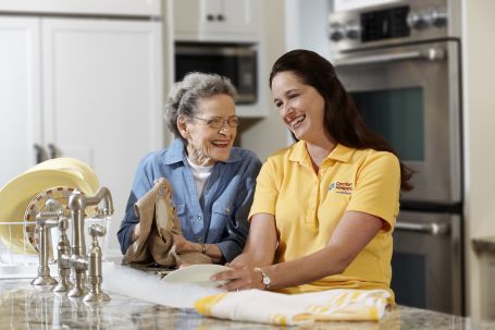 A senior and their caregiver in the kitchen