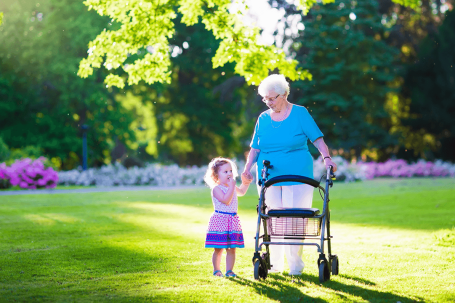 Plymouth senior with walker and her granddaughter in a park