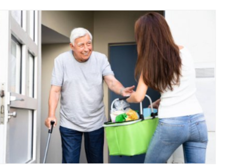 Caregiver helping a senior with grocery