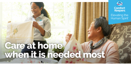 Senior and Caregiver Practicing Social Distancing At Home