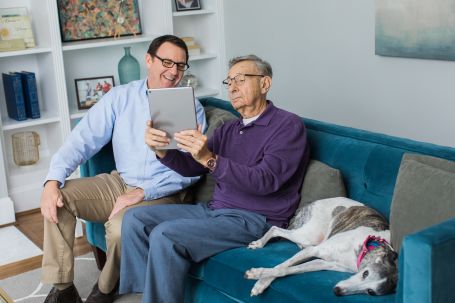 woman drinking coffee with caregiver
