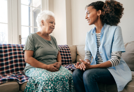 Caregiver talking with mom and son