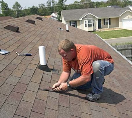 Roofer working on senior's house