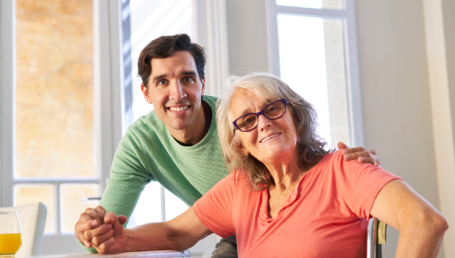 young man and woman smiling for the camera 