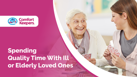 An older woman and a younger woman playing cards
