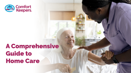 Older female being assisted by a male care giver