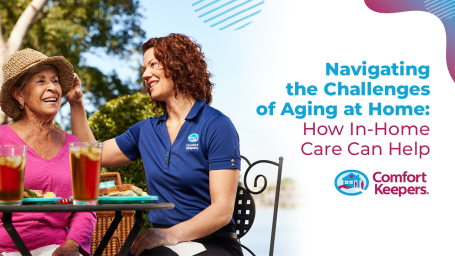 An elderly woman being accompanied by a younger woman smiling.